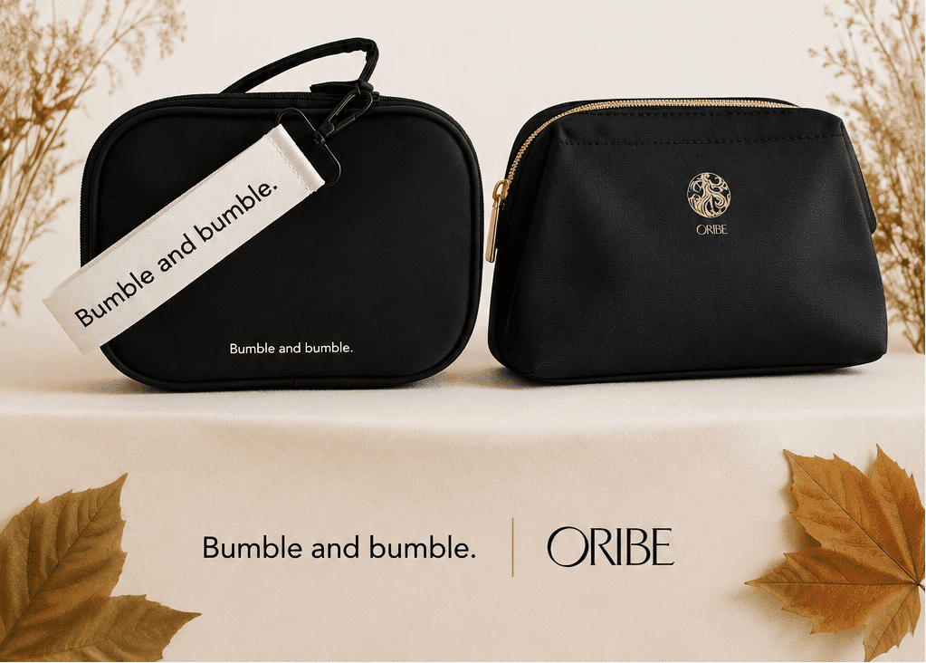 Two black cosmetic bags with Bumble and Bumble and Oribe branding, surrounded by autumn leaves.