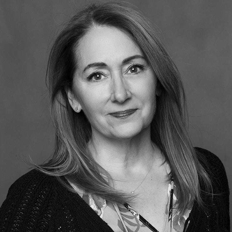 Portrait of Pam, a professional stylist at Joe's Salon, showcasing their expertise and style.