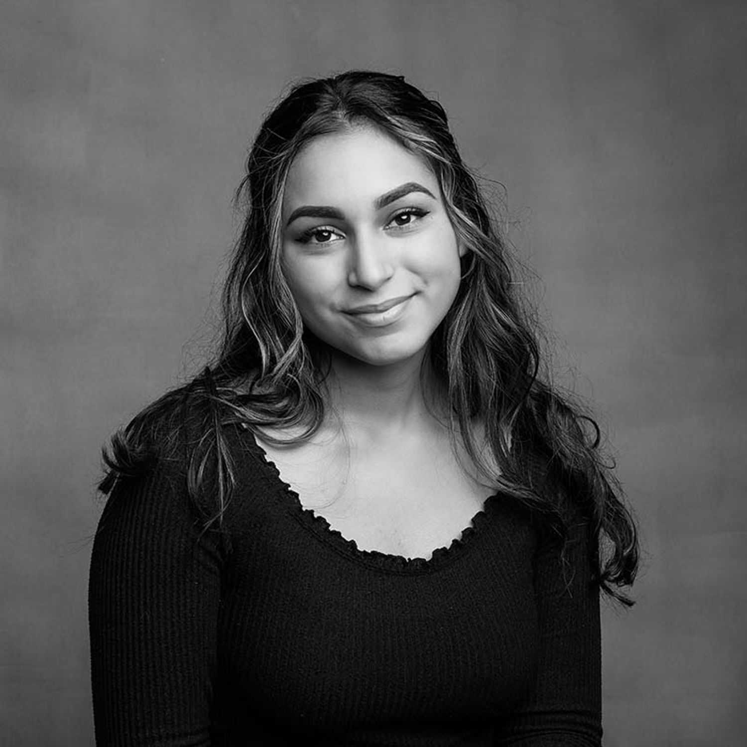 Portrait of Mellany, a professional stylist at Joe's Salon, showcasing their expertise and style.