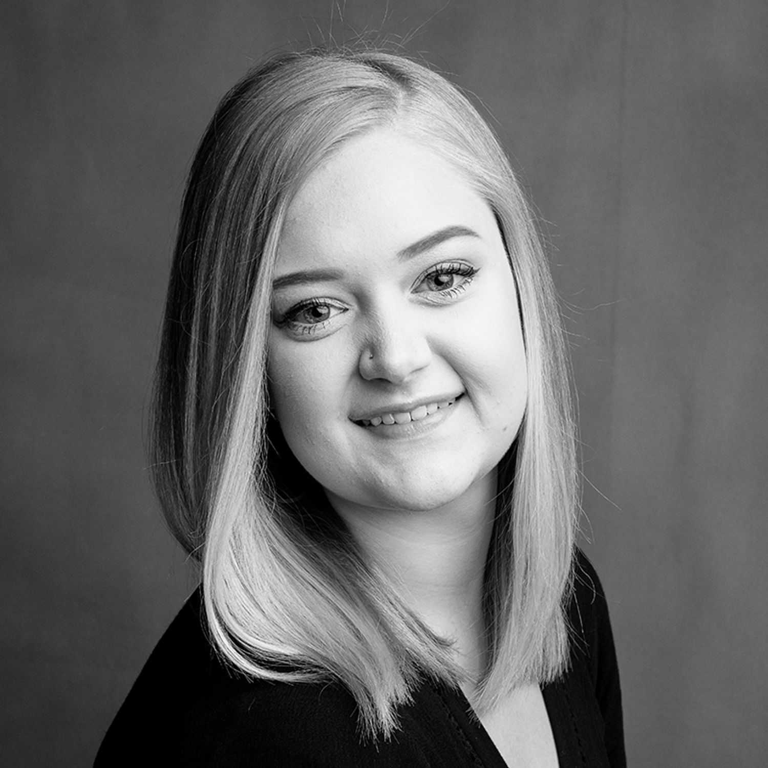 Portrait of Jordan, a professional stylist at Joe's Salon, showcasing their expertise and style.