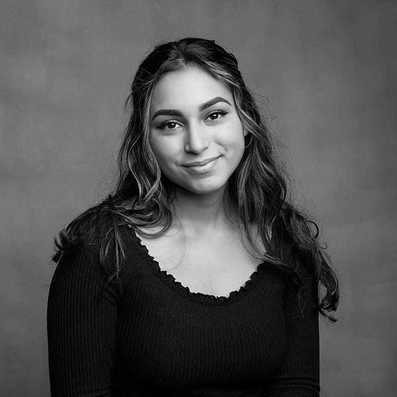 Portrait of Mellany, a professional stylist at Joe's Salon, showcasing their expertise and style.