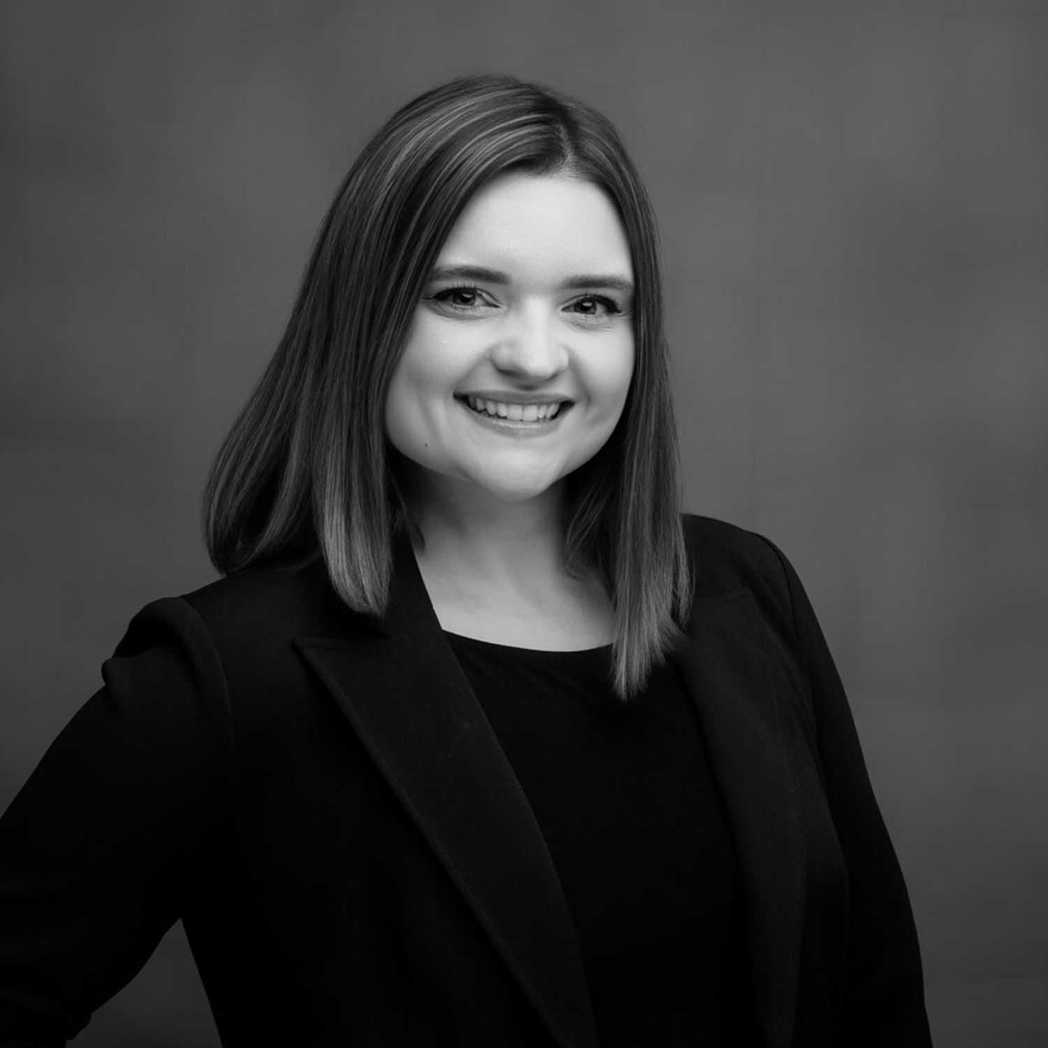 Portrait of Regina, a professional stylist at Joe's Salon, showcasing their expertise and style.