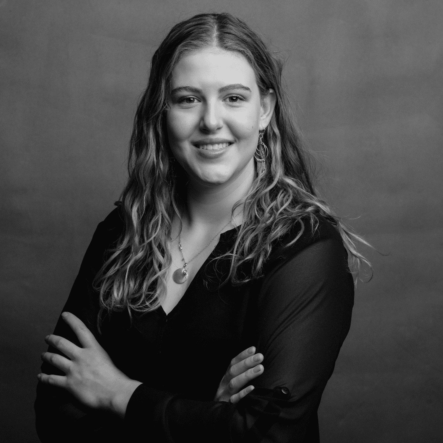 Portrait of Abi, a professional stylist at Joe's Salon, showcasing their expertise and style.