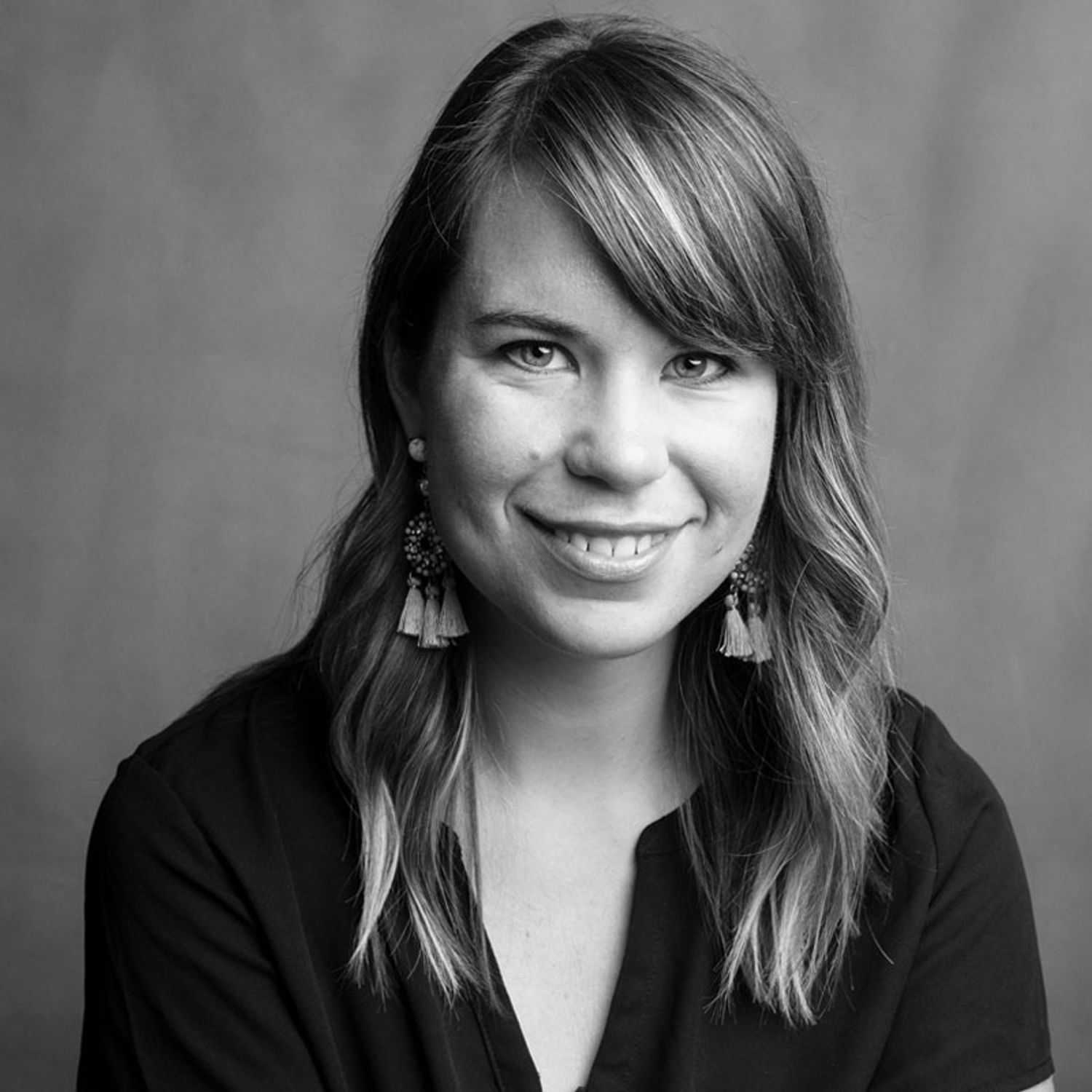 Portrait of Alexis, a professional stylist at Joe's Salon, showcasing their expertise and style.