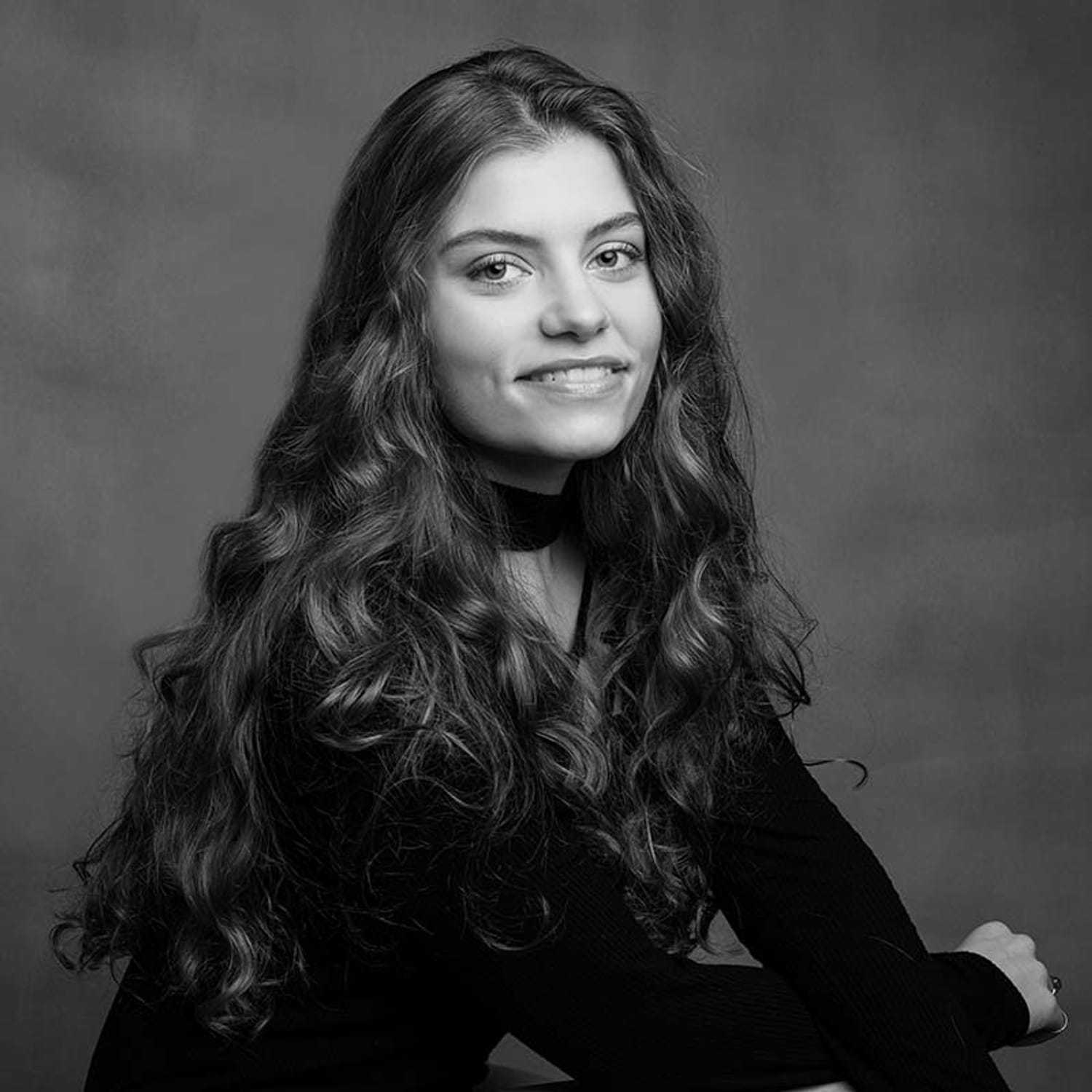 Portrait of Emily, a professional stylist at Joe's Salon, showcasing their expertise and style.