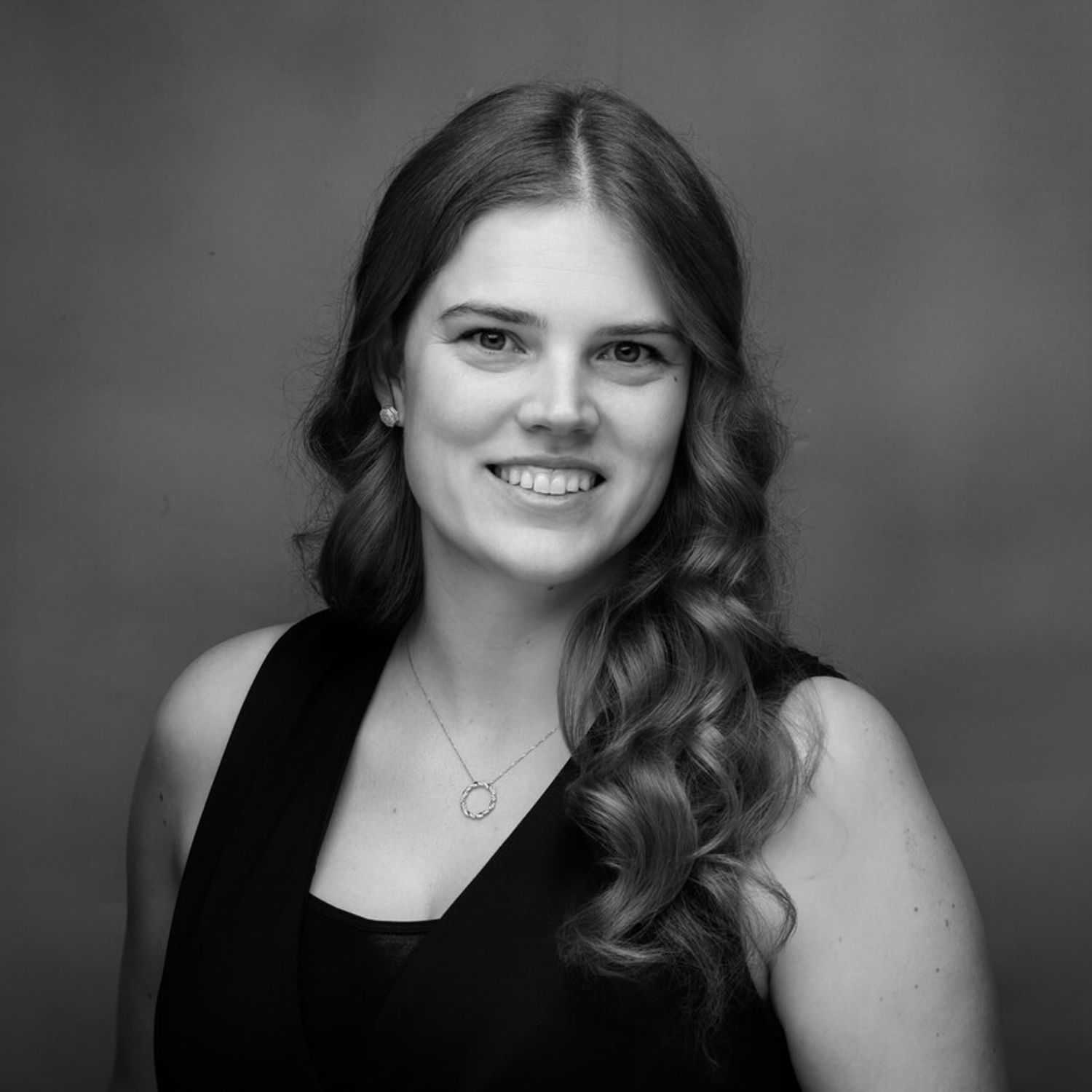 Portrait of Maggie, a professional stylist at Joe's Salon, showcasing their expertise and style.