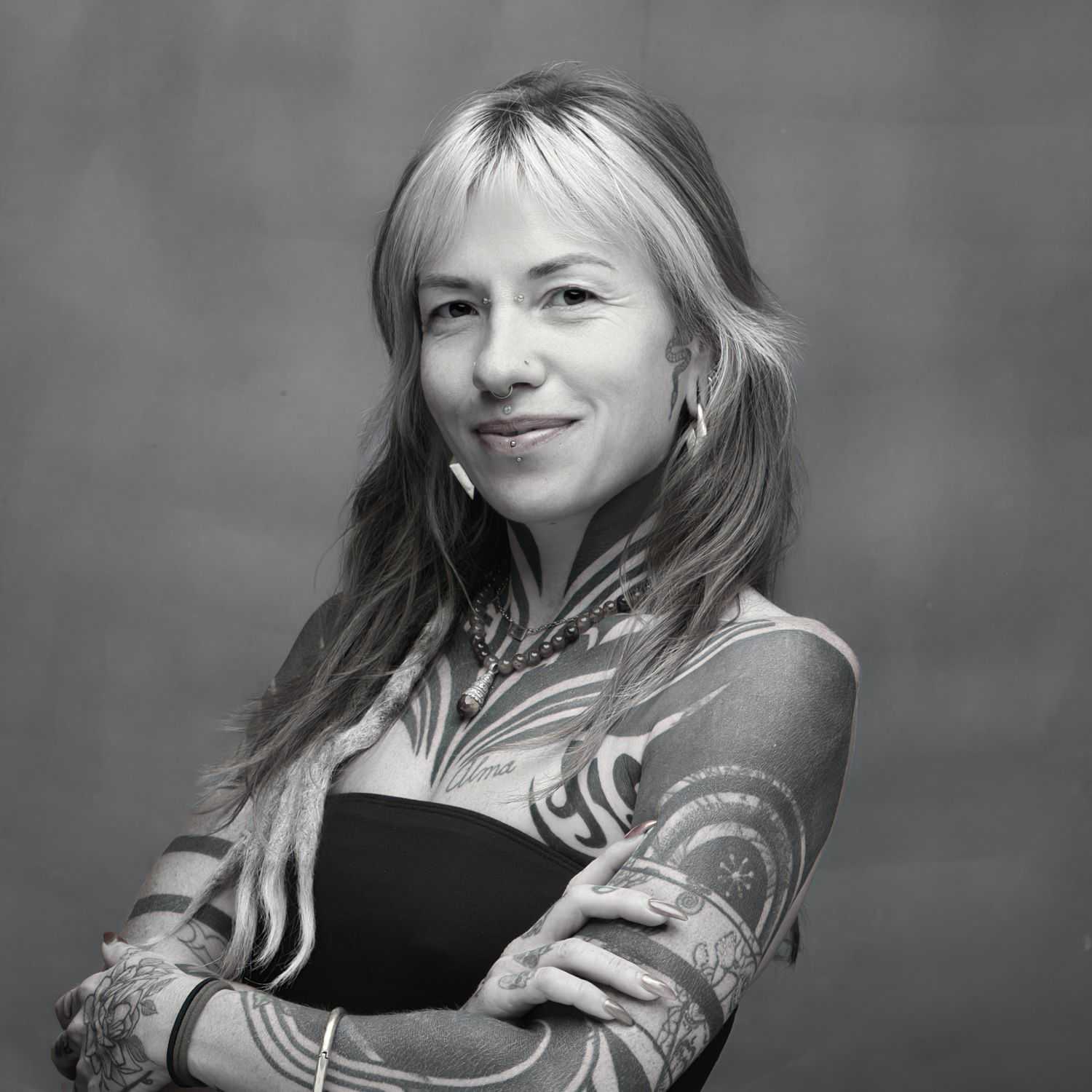 Portrait of Joana, a professional stylist at Joe's Salon, showcasing their expertise and style.