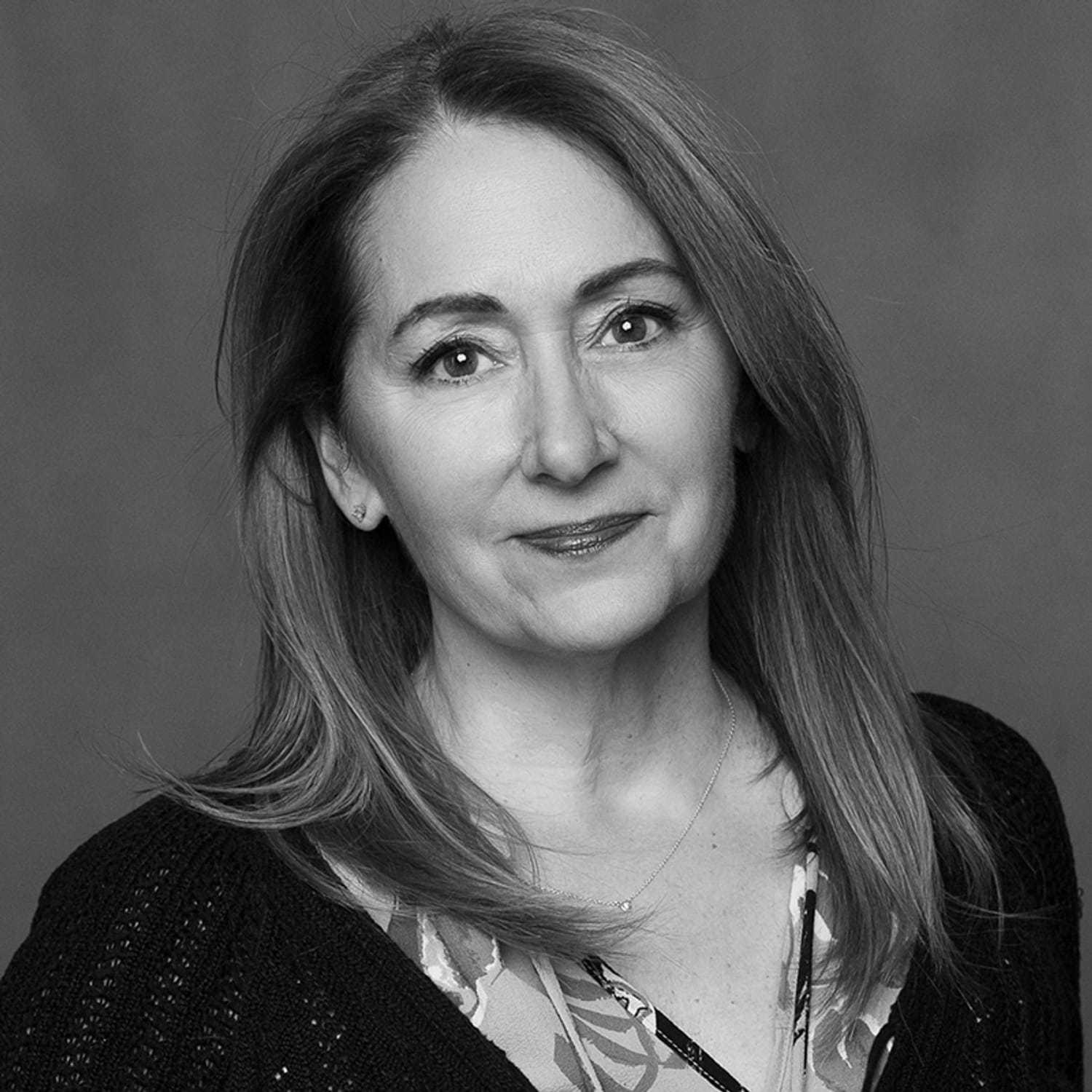 Portrait of Pam, a professional stylist at Joe's Salon, showcasing their expertise and style.