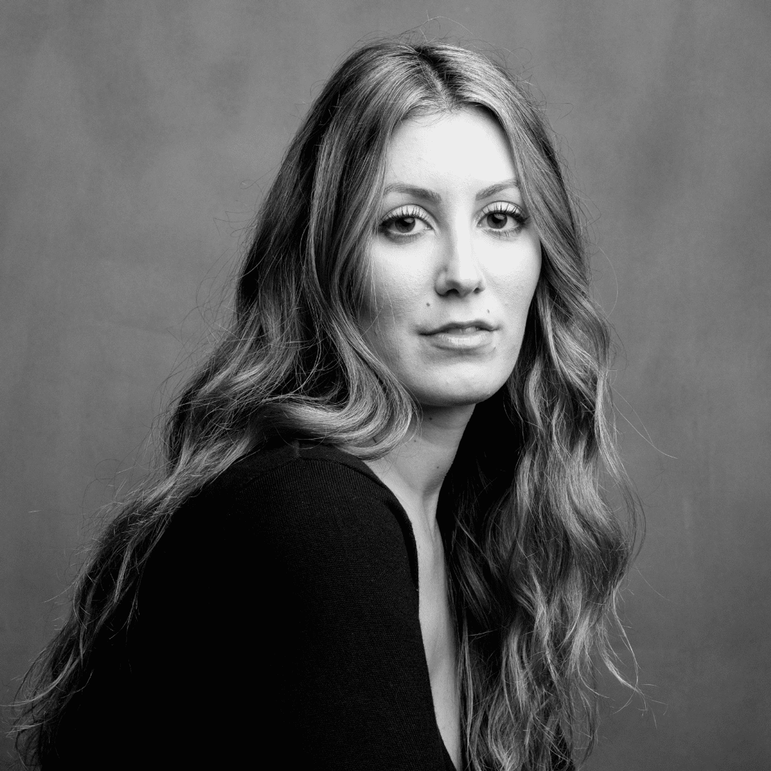 Portrait of Sarah, a professional stylist at Joe's Salon, showcasing their expertise and style.